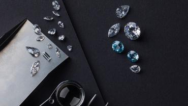 Gemstones and magnifying glass